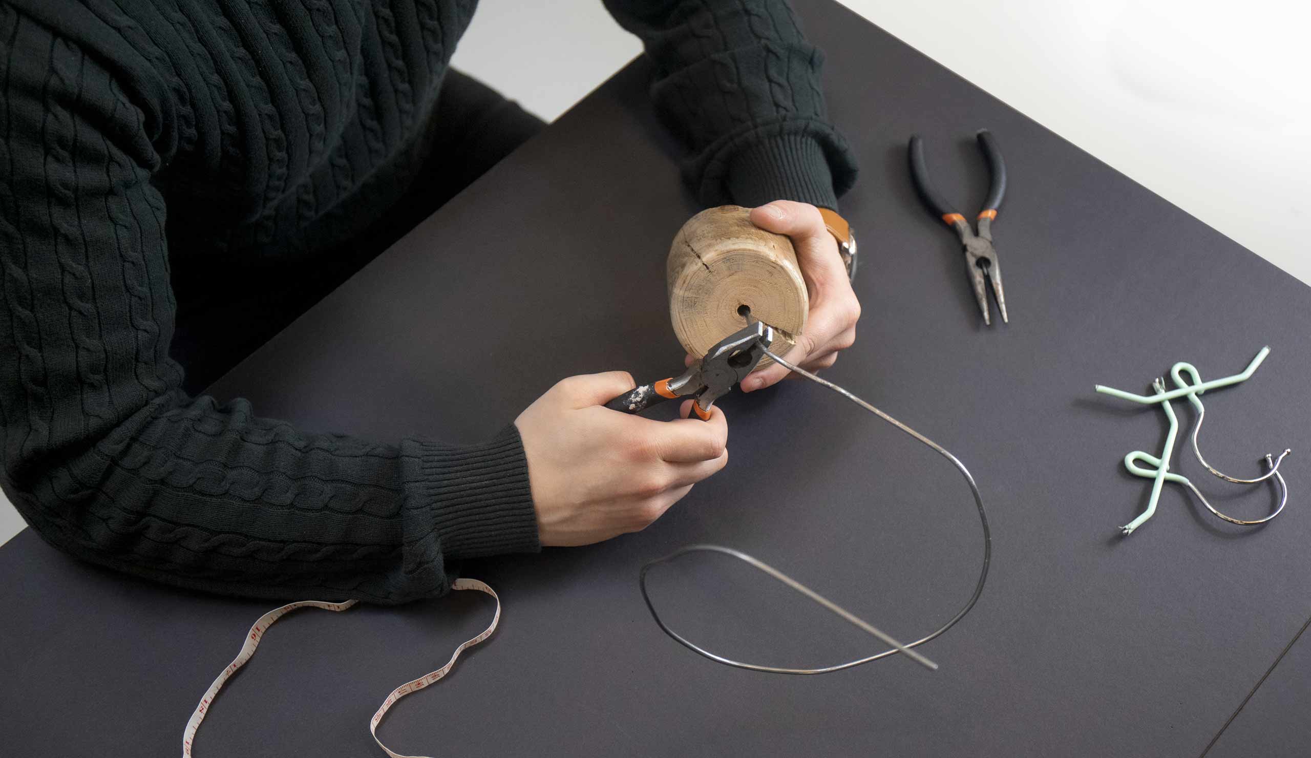 Kyle Wilkinson Studio bending wire to create a trophy shape.